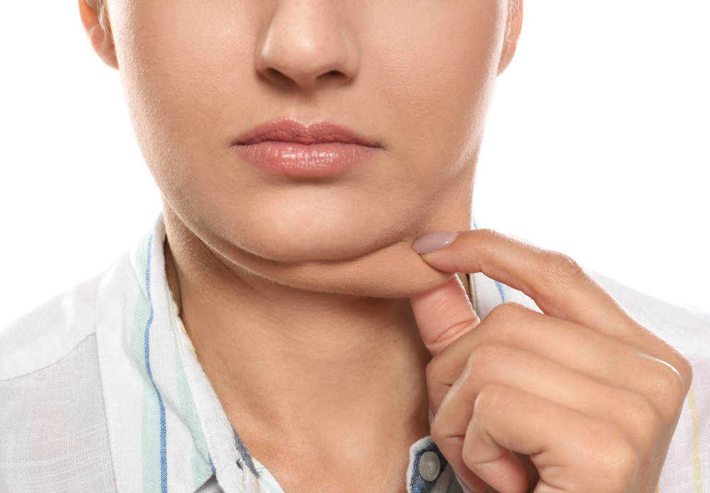 Young,Woman,With,Double,Chin,On,White,Background,,Closeup